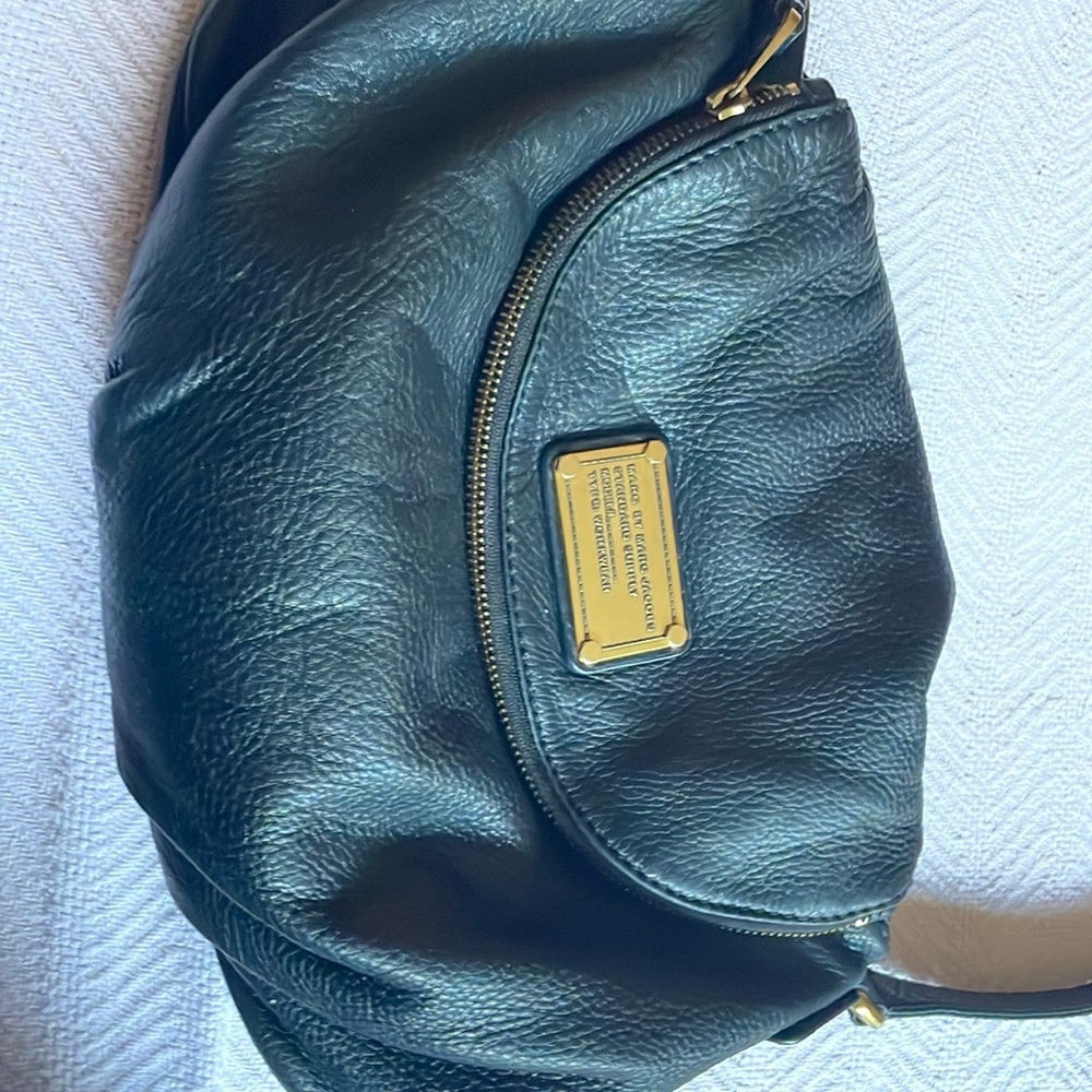 Marc Jacob’s black leather handbag. Darling over the shoulder bag.